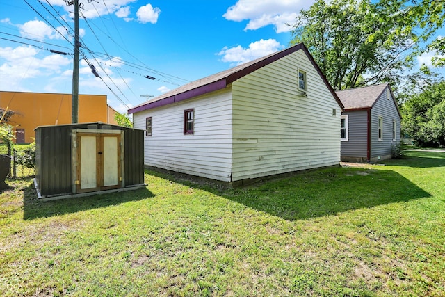 11 14th St, Franklin, IN 46131 - view of side of property with a yard and a shingled roof