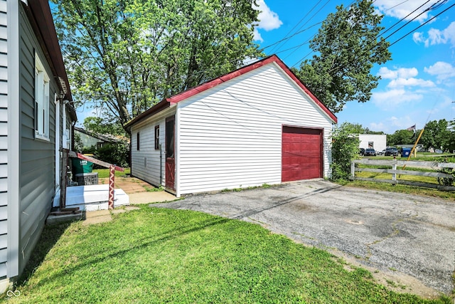 11 14th St, Franklin, IN 46131 - detached garage featuring asphalt driveway