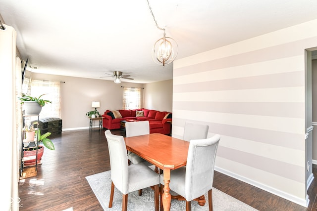 12343 Slate Dr, Fishers, IN 46037 - dining space with a chandelier, baseboards, ceiling fan, and dark wood-type flooring