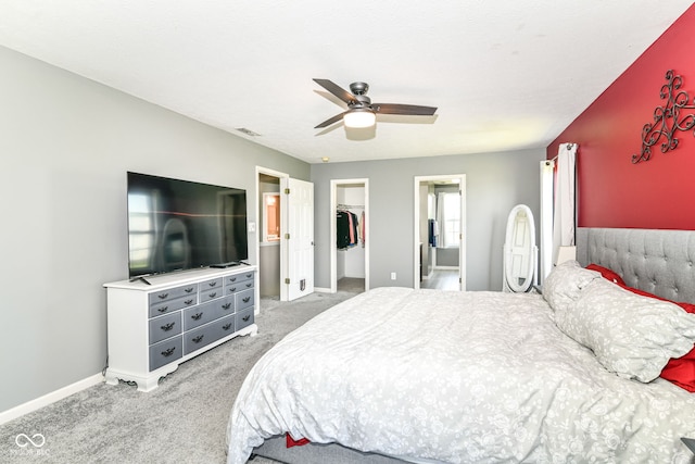 12343 Slate Dr, Fishers, IN 46037 - carpeted bedroom featuring a spacious closet, baseboards, a closet, a ceiling fan, and ensuite bathroom