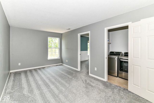 12343 Slate Dr, Fishers, IN 46037 - empty room with washer and clothes dryer, light colored carpet, and baseboards