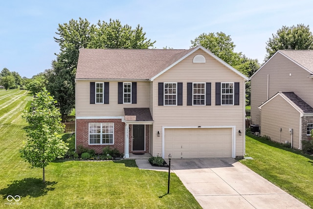 12343 Slate Dr, Fishers, IN 46037 - traditional-style house with a garage, concrete driveway, a front yard, brick siding, and a shingled roof