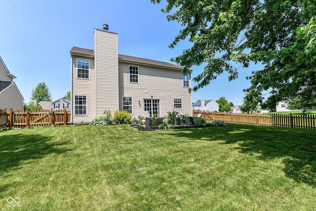 12343 Slate Dr, Fishers, IN 46037 - rear view of property with a chimney