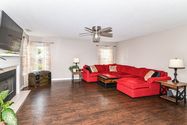 12343 Slate Dr, Fishers, IN 46037 - living area with wood finished floors, a fireplace, plenty of natural light, and a textured ceiling