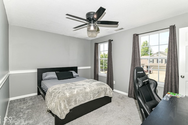 12343 Slate Dr, Fishers, IN 46037 - carpeted bedroom with baseboards and ceiling fan