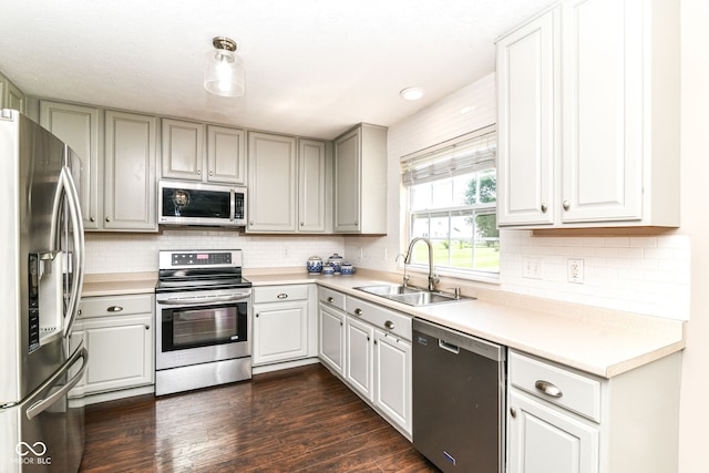 12343 Slate Dr, Fishers, IN 46037 - kitchen with appliances with stainless steel finishes, a sink, decorative backsplash, and light countertops