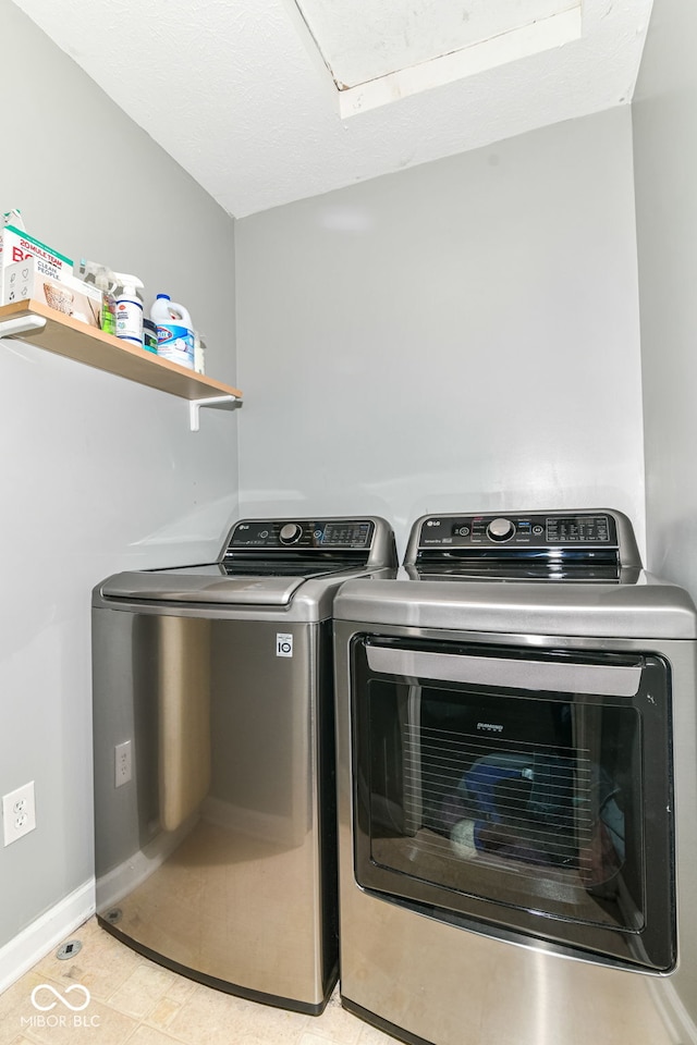 12343 Slate Dr, Fishers, IN 46037 - laundry room with separate washer and dryer, light tile patterned floors, and baseboards