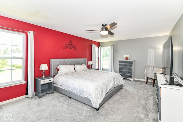 12343 Slate Dr, Fishers, IN 46037 - bedroom featuring light carpet, baseboards, and ceiling fan