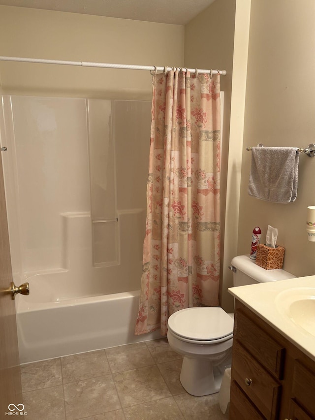 5148 Constitution Ct, Columbus, IN 47203 - full bath featuring toilet, vanity, shower / bath combo with shower curtain, and tile patterned floors