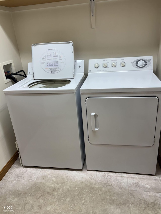 5148 Constitution Ct, Columbus, IN 47203 - laundry area featuring separate washer and dryer and baseboards