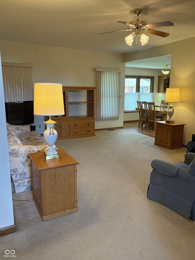 5148 Constitution Ct, Columbus, IN 47203 - carpeted living area featuring a ceiling fan