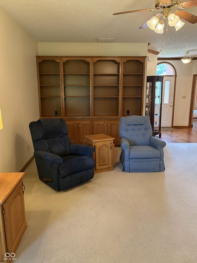 5148 Constitution Ct, Columbus, IN 47203 - sitting room with carpet flooring, ceiling fan, and baseboards