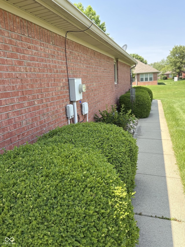 5148 Constitution Ct, Columbus, IN 47203 - view of side of property with brick siding and a yard