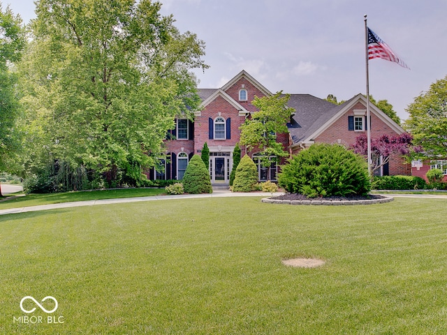 4075 Dartmoor Dr, Greenwood, IN 46143 - colonial house with brick siding and a front yard