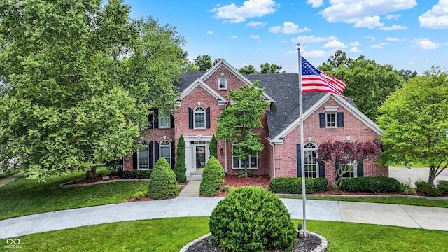 4075 Dartmoor Dr, Greenwood, IN 46143 - view of front facade featuring brick siding and a front yard