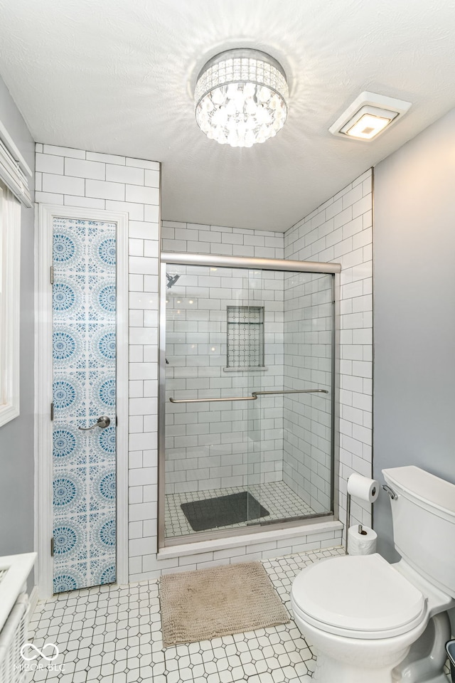 164 Wellington Pkwy, Noblesville, IN 46060 - bathroom featuring toilet and a stall shower