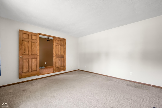 3210 Flintwood Dr, Columbus, IN 47203 - carpeted empty room featuring baseboards