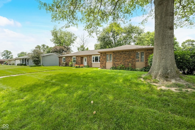 3210 Flintwood Dr, Columbus, IN 47203 - ranch-style house featuring a front lawn and brick siding