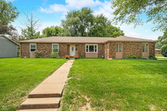 3210 Flintwood Dr, Columbus, IN 47203 - ranch-style house featuring brick siding and a front yard