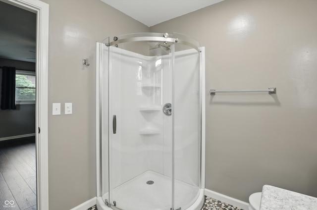 8635 Bishops Ln, Indianapolis, IN 46217 - full bath with a stall shower, baseboards, and toilet