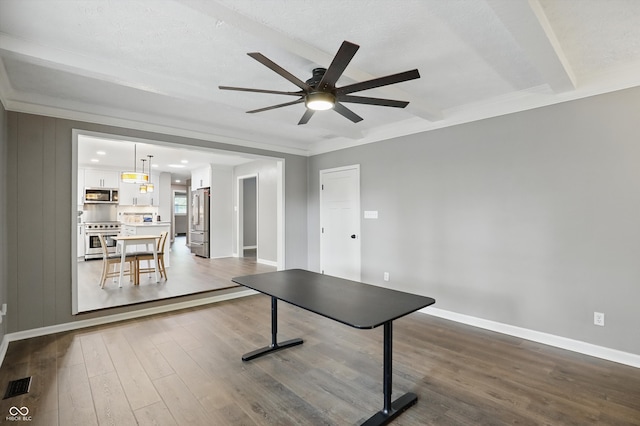 8635 Bishops Ln, Indianapolis, IN 46217 - playroom featuring ceiling fan, dark wood finished floors, baseboards, beam ceiling, and crown molding