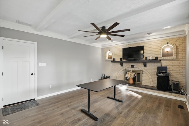 8635 Bishops Ln, Indianapolis, IN 46217 - recreation room with a brick fireplace, a ceiling fan, wood finished floors, baseboards, and beam ceiling