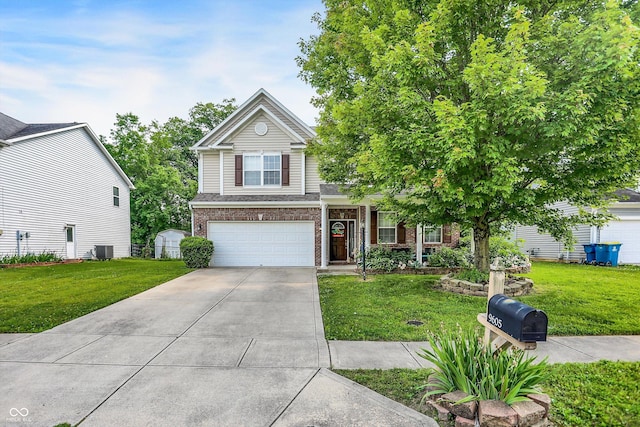 9605 Treyburn Green Way, Indianapolis, IN 46239 - view of front facade with concrete driveway, a front lawn, and an attached garage