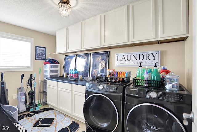 9605 Treyburn Green Way, Indianapolis, IN 46239 - laundry room featuring independent washer and dryer, cabinet space, and a textured ceiling