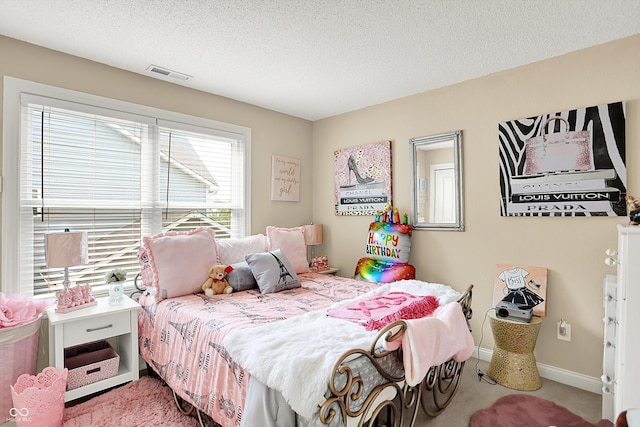 9605 Treyburn Green Way, Indianapolis, IN 46239 - carpeted bedroom featuring a textured ceiling and baseboards