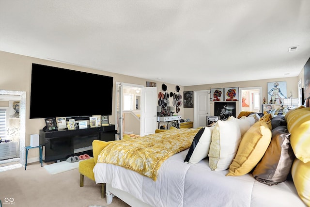 9605 Treyburn Green Way, Indianapolis, IN 46239 - bedroom with light colored carpet, multiple windows, and ensuite bath