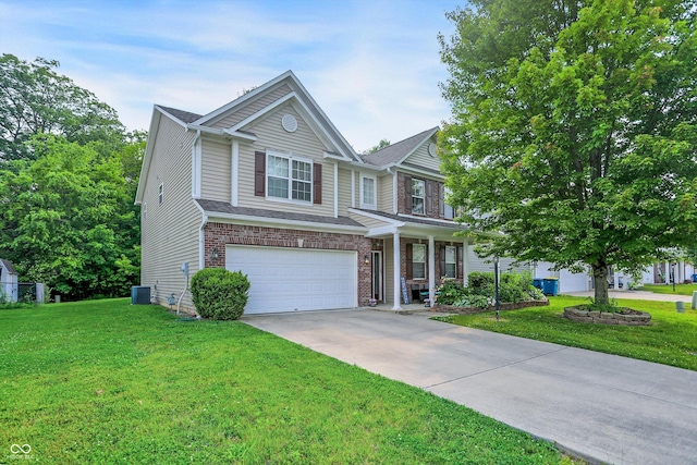 9605 Treyburn Green Way, Indianapolis, IN 46239 - view of front of property featuring a garage, a front yard, concrete driveway, and a porch