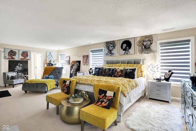 9605 Treyburn Green Way, Indianapolis, IN 46239 - bedroom with a textured ceiling and light carpet