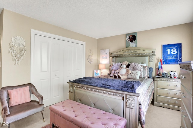 9605 Treyburn Green Way, Indianapolis, IN 46239 - carpeted bedroom with a closet and a textured ceiling