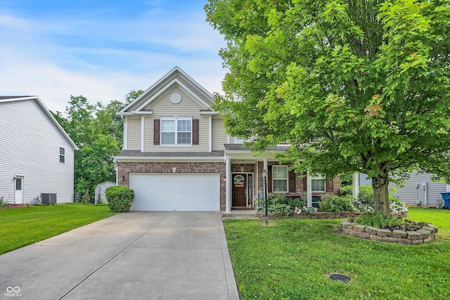 9605 Treyburn Green Way, Indianapolis, IN 46239 - view of front of house with concrete driveway, a front lawn, a garage, and brick siding