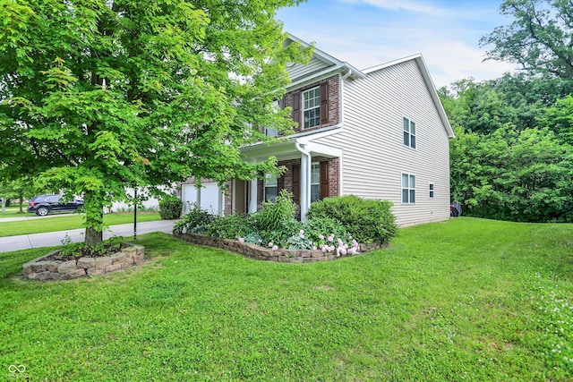 9605 Treyburn Green Way, Indianapolis, IN 46239 - view of property exterior featuring driveway and a lawn