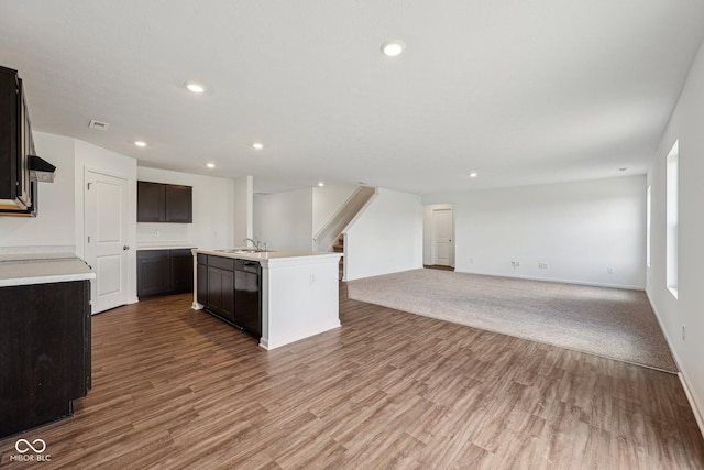 1304 Vera Blvd, Danville, IN 46122 - kitchen featuring open floor plan, a sink, black dishwasher, wood finished floors, and recessed lighting