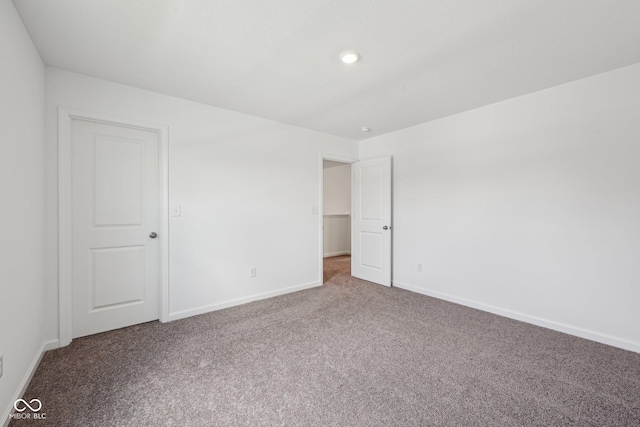 1304 Vera Blvd, Danville, IN 46122 - unfurnished bedroom featuring carpet flooring, baseboards, and recessed lighting