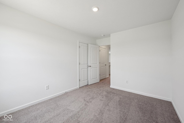 1304 Vera Blvd, Danville, IN 46122 - unfurnished bedroom with carpet flooring, baseboards, and recessed lighting