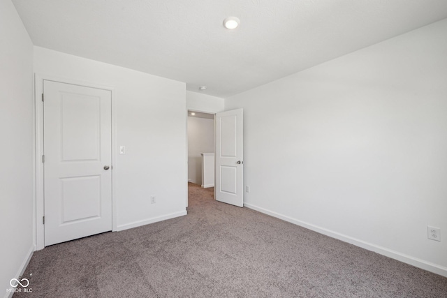 1304 Vera Blvd, Danville, IN 46122 - unfurnished bedroom featuring carpet, baseboards, and recessed lighting