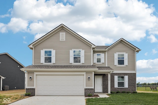 1304 Vera Blvd, Danville, IN 46122 - view of front of house with brick siding, central AC unit, driveway, a garage, and a shingled roof