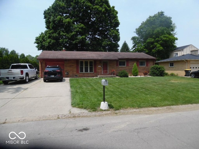 213 S Coventry Dr, Anderson, IN 46012 - single story home featuring an attached garage, driveway, a front lawn, and brick siding