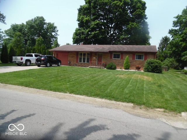 213 S Coventry Dr, Anderson, IN 46012 - single story home featuring an attached garage, driveway, and a front yard