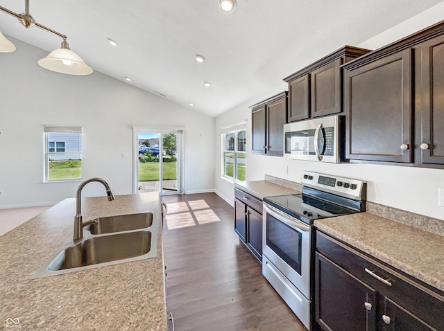 10112 James Run Dr, Indianapolis, IN 46239 - kitchen with stainless steel appliances, a sink, vaulted ceiling, dark brown cabinets, and recessed lighting