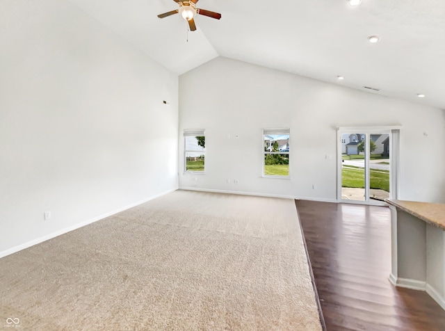 10112 James Run Dr, Indianapolis, IN 46239 - unfurnished living room with a ceiling fan, baseboards, high vaulted ceiling, recessed lighting, and dark wood-type flooring