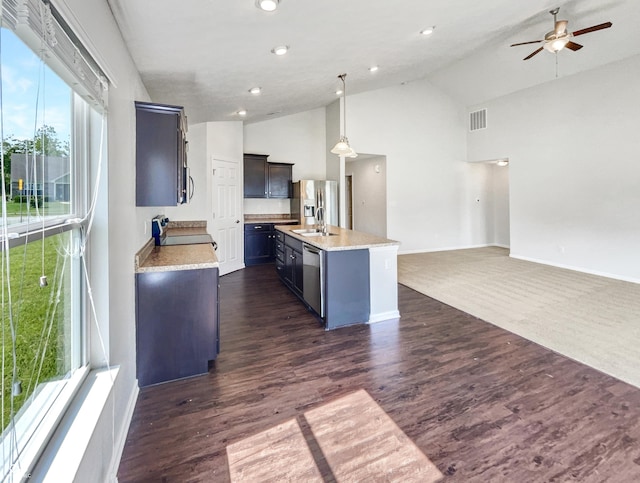 10112 James Run Dr, Indianapolis, IN 46239 - kitchen featuring a sink, open floor plan, ceiling fan, appliances with stainless steel finishes, and high vaulted ceiling