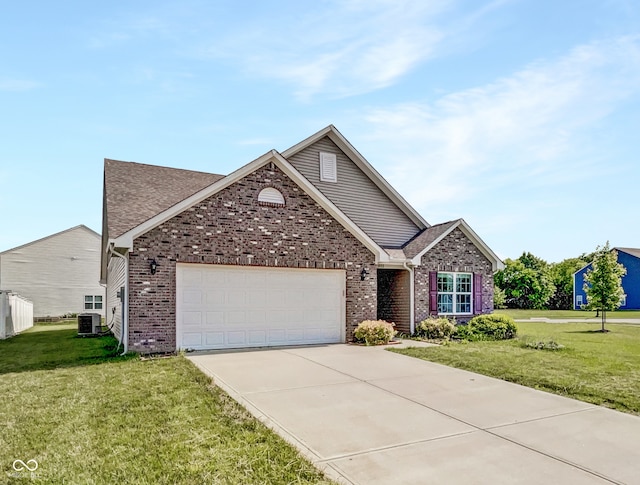 10112 James Run Dr, Indianapolis, IN 46239 - view of front of property with central AC unit, a garage, a front lawn, and driveway