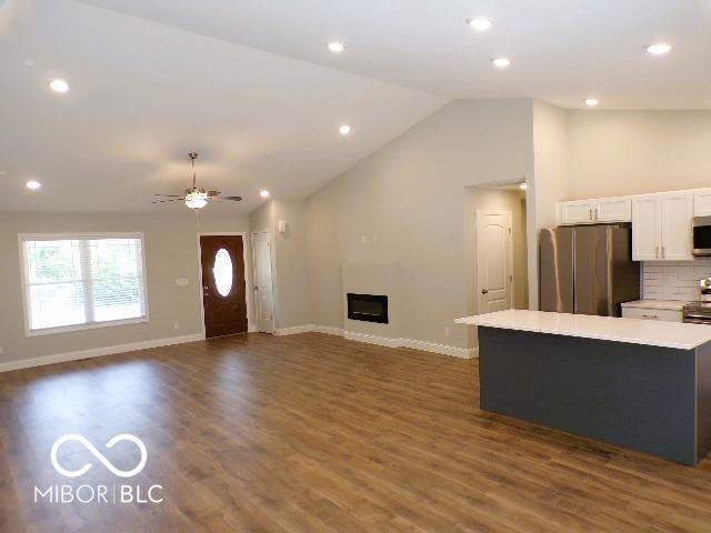 3204 N County Road 900 E, Seymour, IN 47274 - kitchen featuring appliances with stainless steel finishes, white cabinets, light countertops, baseboards, and dark wood-type flooring