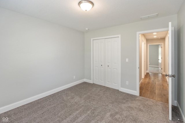 3204 N County Road 900 E, Seymour, IN 47274 - unfurnished bedroom featuring a closet and carpet floors