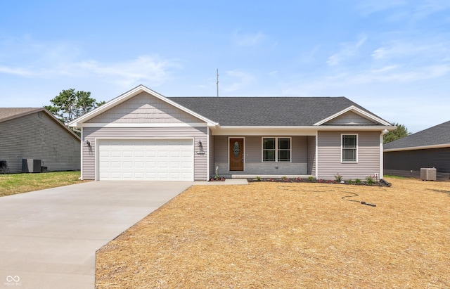 3204 N County Road 900 E, Seymour, IN 47274 - ranch-style home featuring an attached garage, concrete driveway, a porch, and a shingled roof