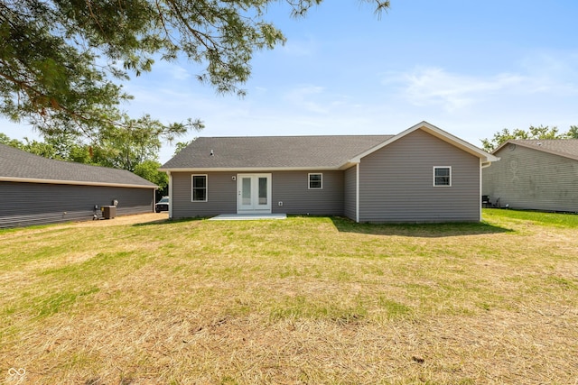3204 N County Road 900 E, Seymour, IN 47274 - rear view of property featuring french doors, a yard, and a shingled roof